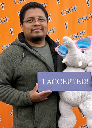 Smiling Compton College Graduate