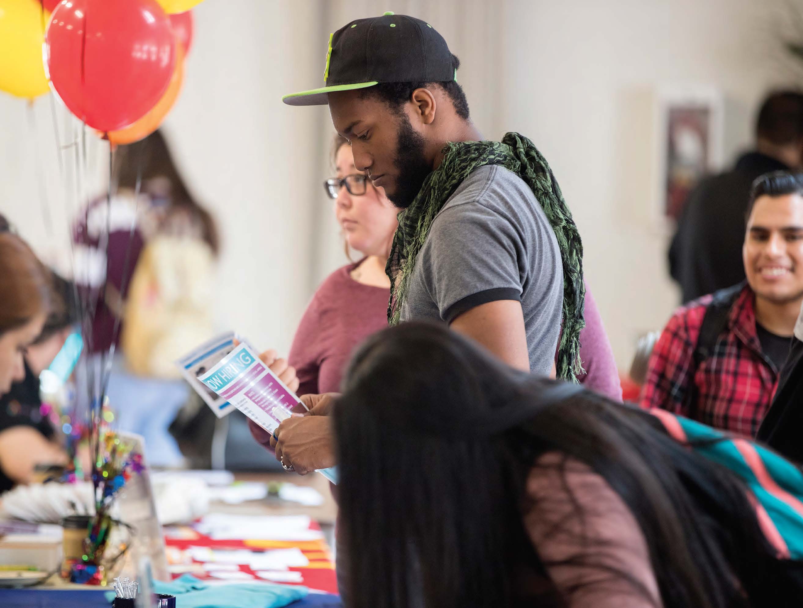 career fair guest with balloons